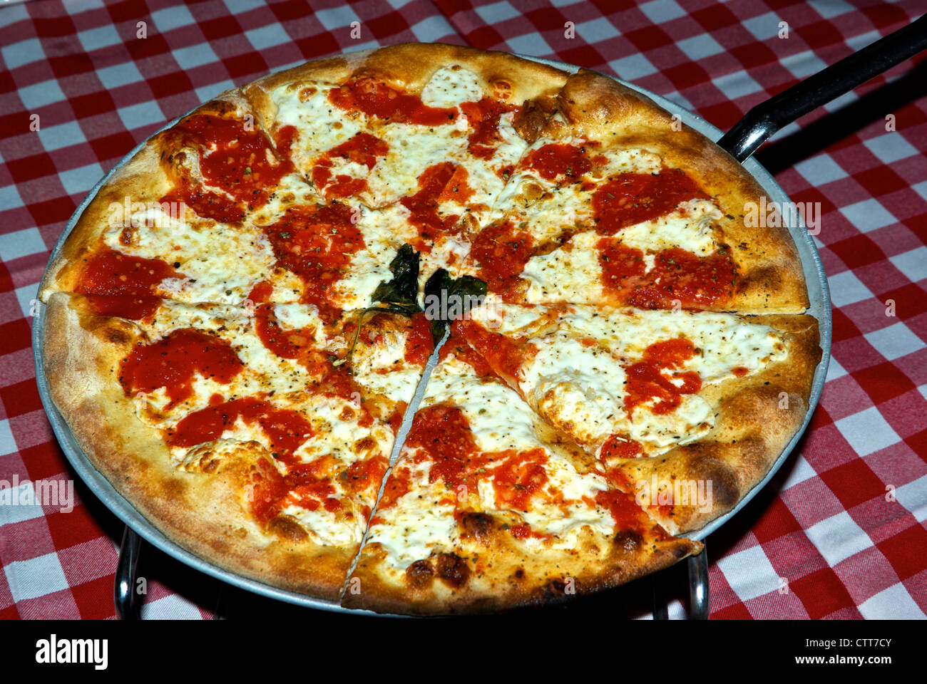 Plain mozzarella cheese whole pizza pie from pan at Grimaldi's