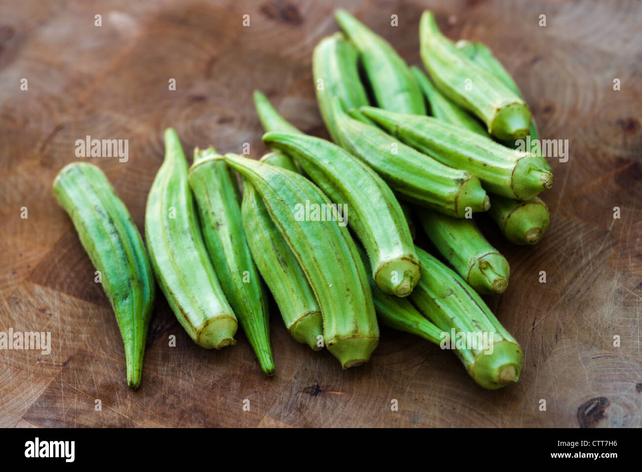 Okra on a chopping board Stock Photo