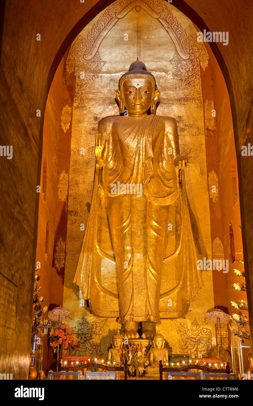 Myanmar, Burma. Bagan. Buddha Statue, Ananda Temple, teak covered in gold leaf. Stock Photo