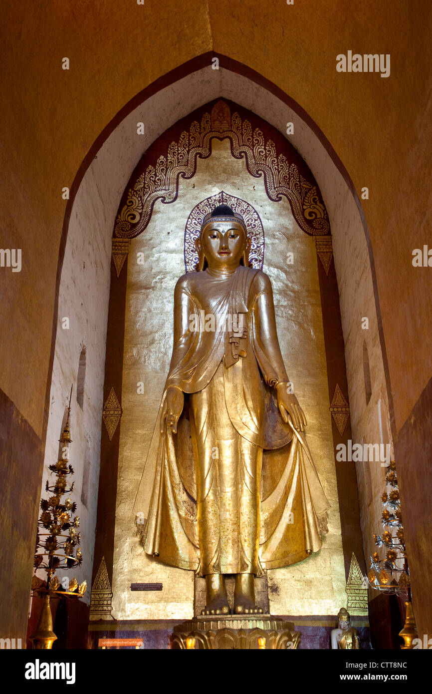 Myanmar, Burma. Bagan. Buddha Statue, Ananda Temple, teak covered in gold leaf. Stock Photo