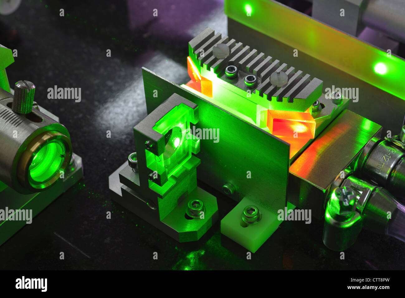 active elements of powerful Ti:Sapphire laser pumped by green light Stock Photo
