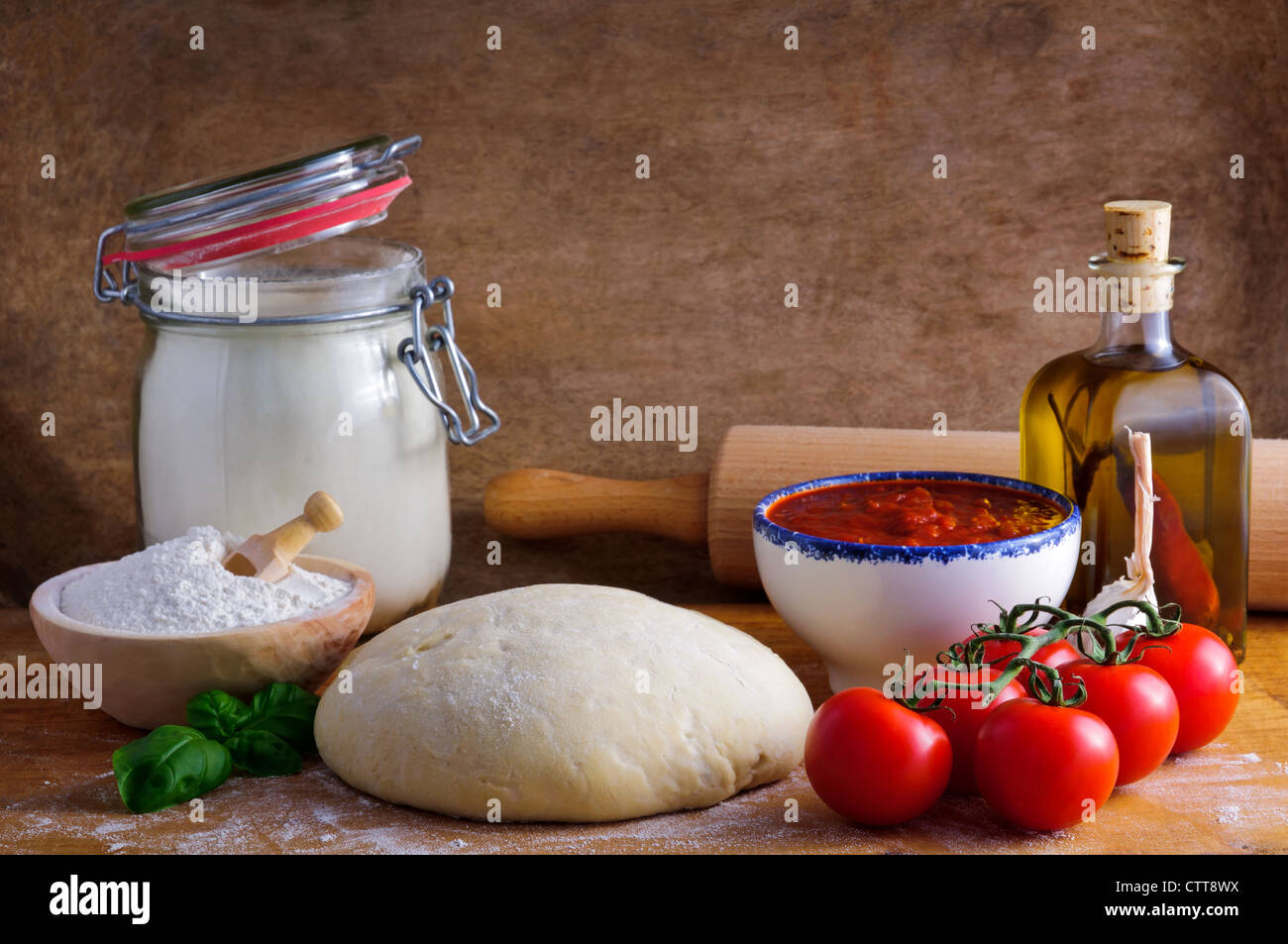 Traditional pizza dough and ingredients Stock Photo