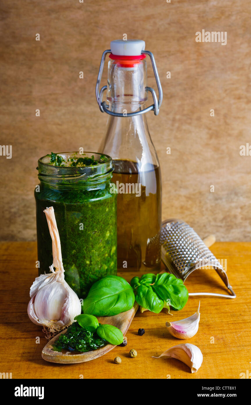 Traditional italian basil pesto and ingredients Stock Photo Alamy