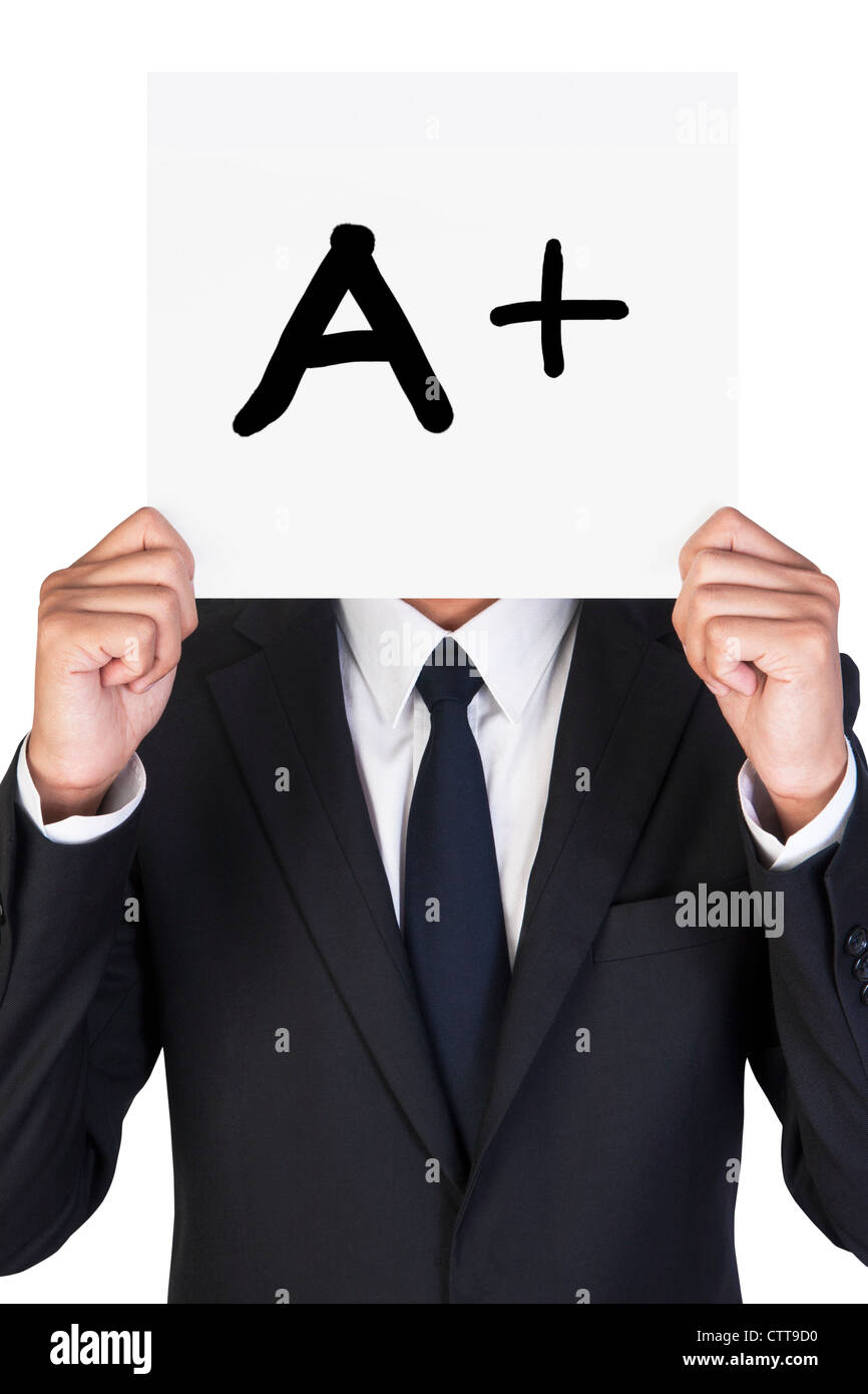 Businessman holding paper that say A plus Stock Photo - Alamy
