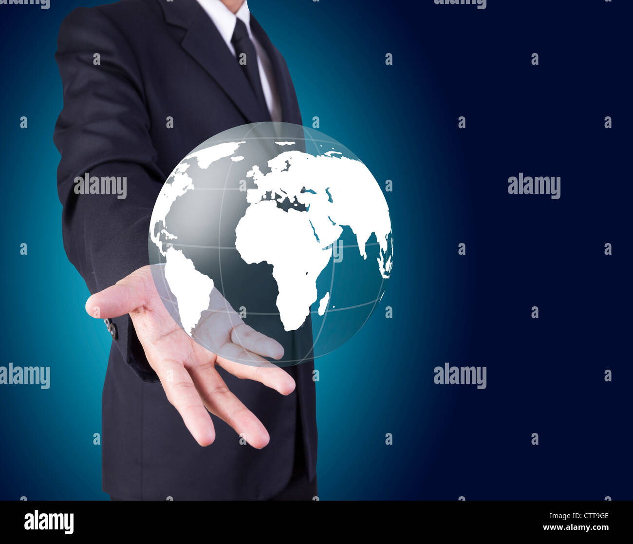 Businessman holding world graphic Stock Photo - Alamy