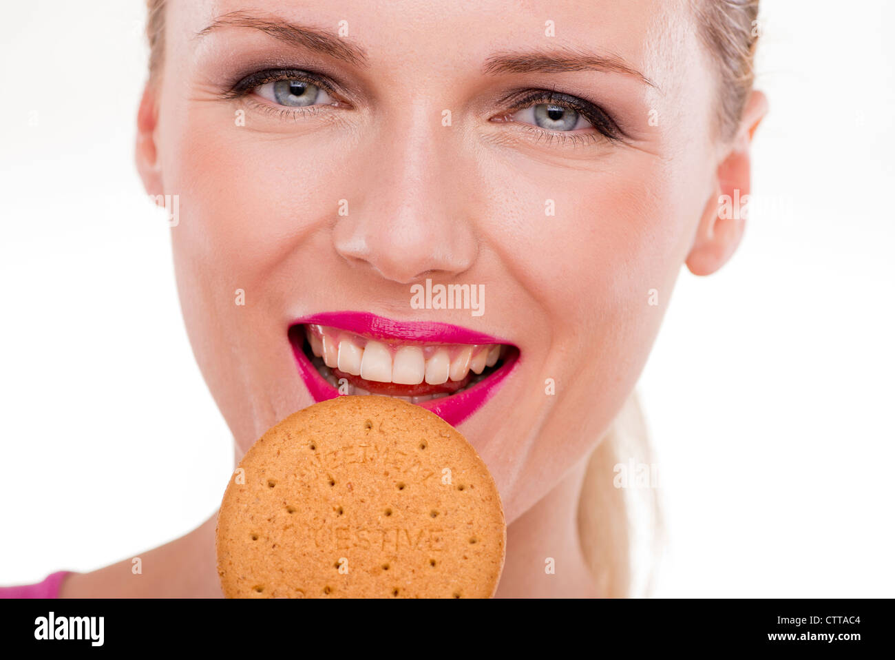 woman eating biting digestive biscuit Stock Photo Alamy