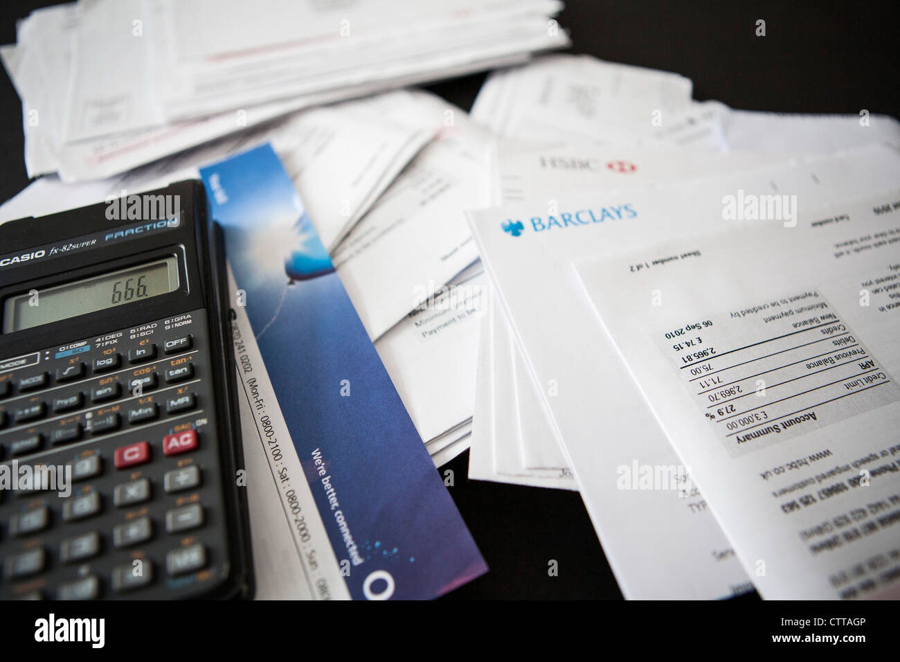 Pile of household, bank and credit card bills with a calculator Stock Photo  - Alamy