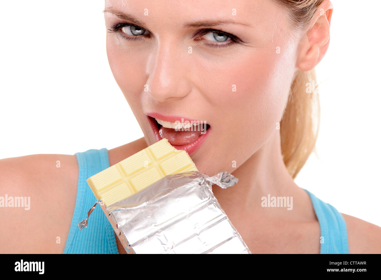 woman eating a bar of white chocolate Stock Photo Alamy