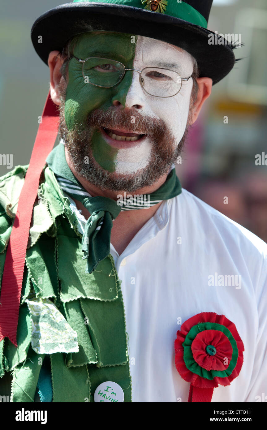 Morris dancer, half green, half white Stock Photo Alamy