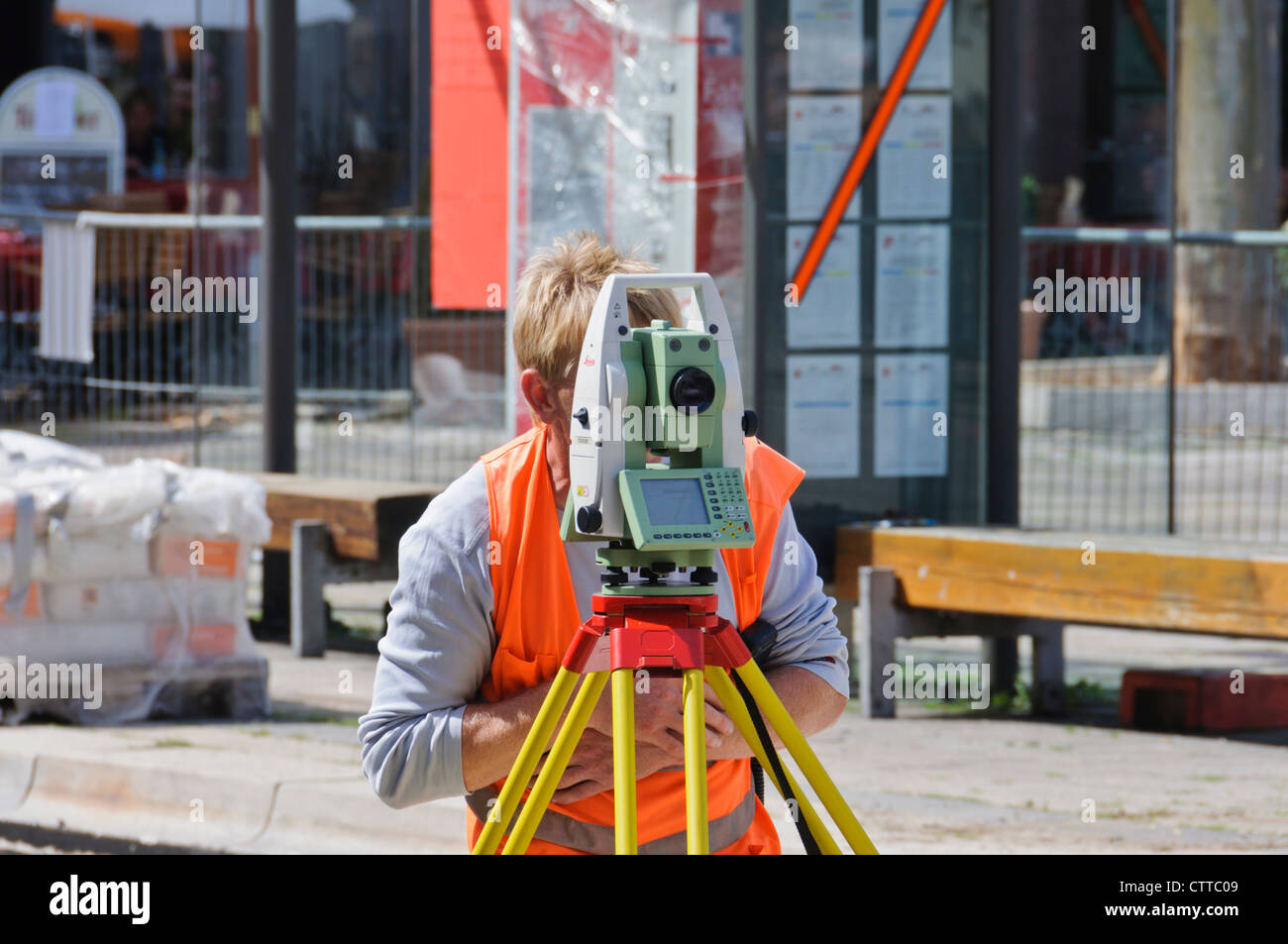 Geodesist land surveyor measures track construction site with modern up to date Leica theodolite