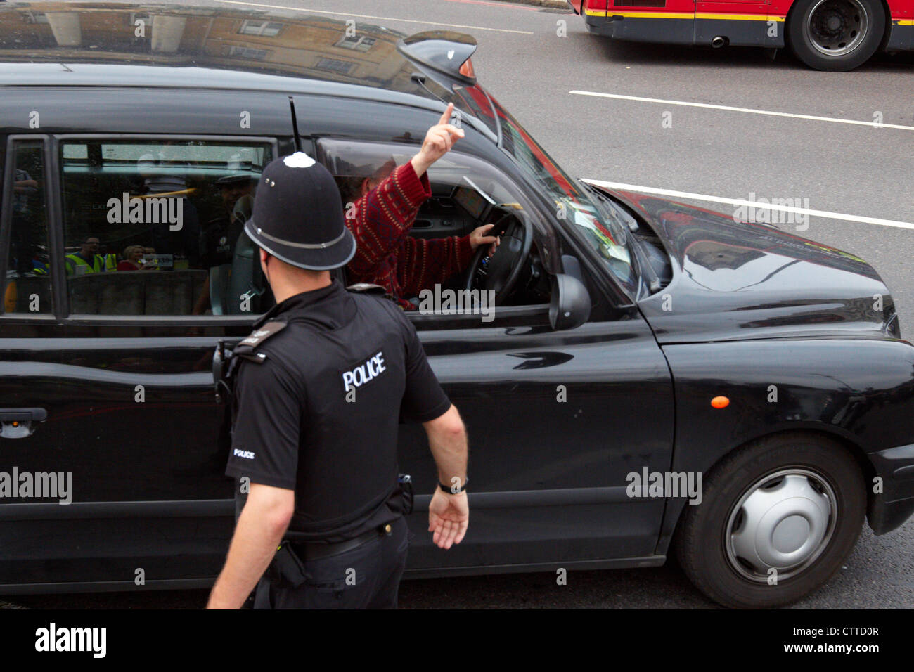Taxi drivers cause gridlock around Hyde Park Corner during a protest