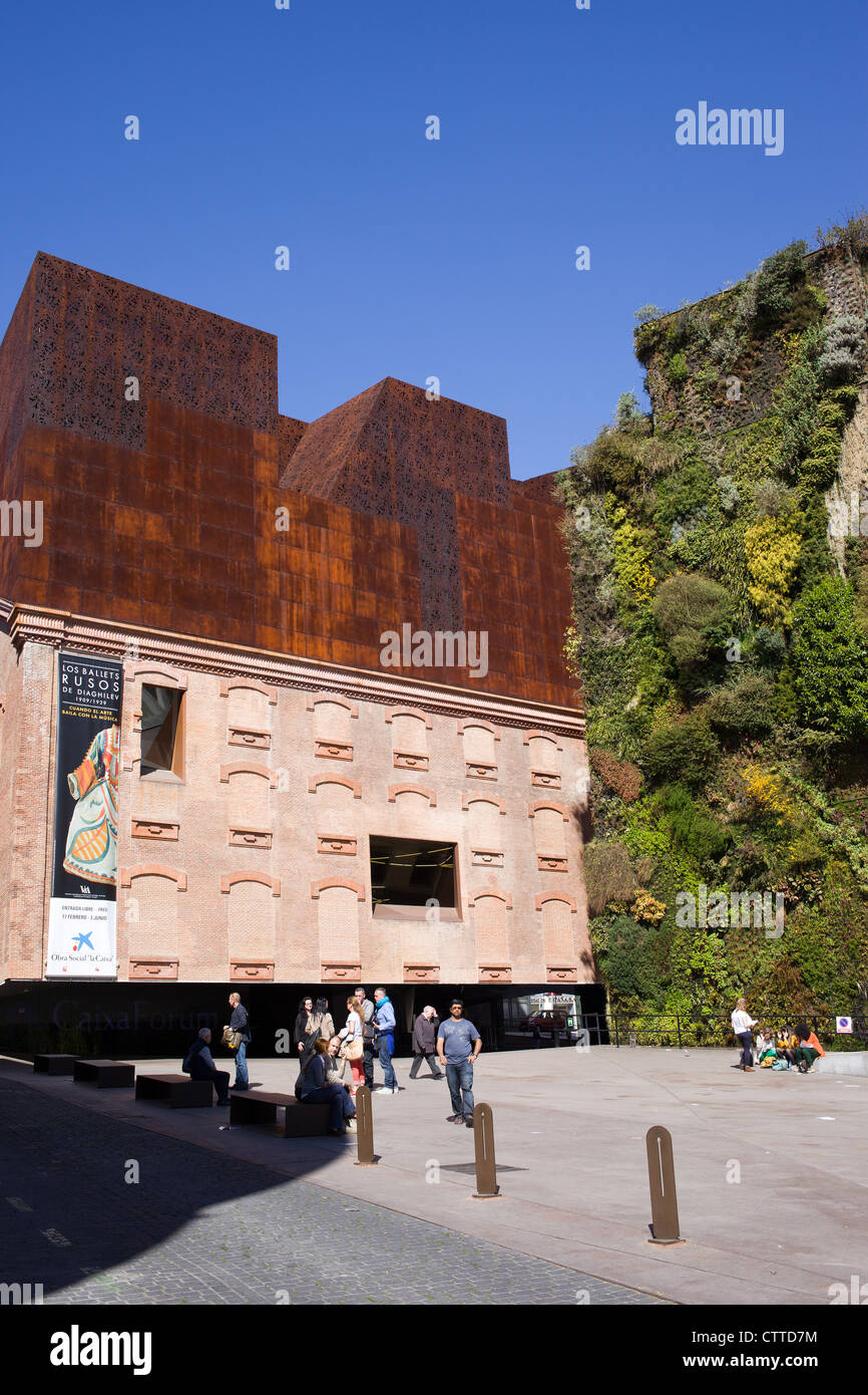 CaixaForum Madrid by Herzog & de Meuron and installation of green plants growing on the wall by Patrik Blanc in Madrid, Spain. Stock Photo