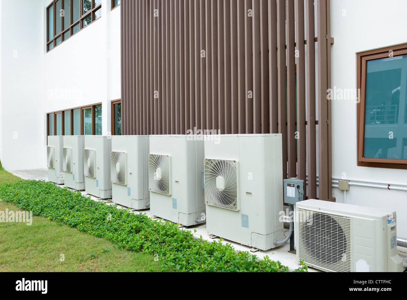 Compressor of air condition are set next to the building Stock Photo
