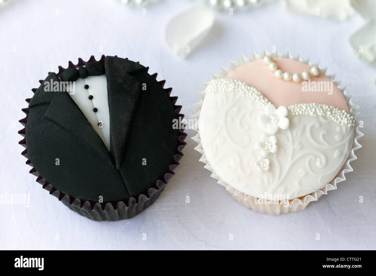 Bride and groom cupcakes Stock Photo Alamy