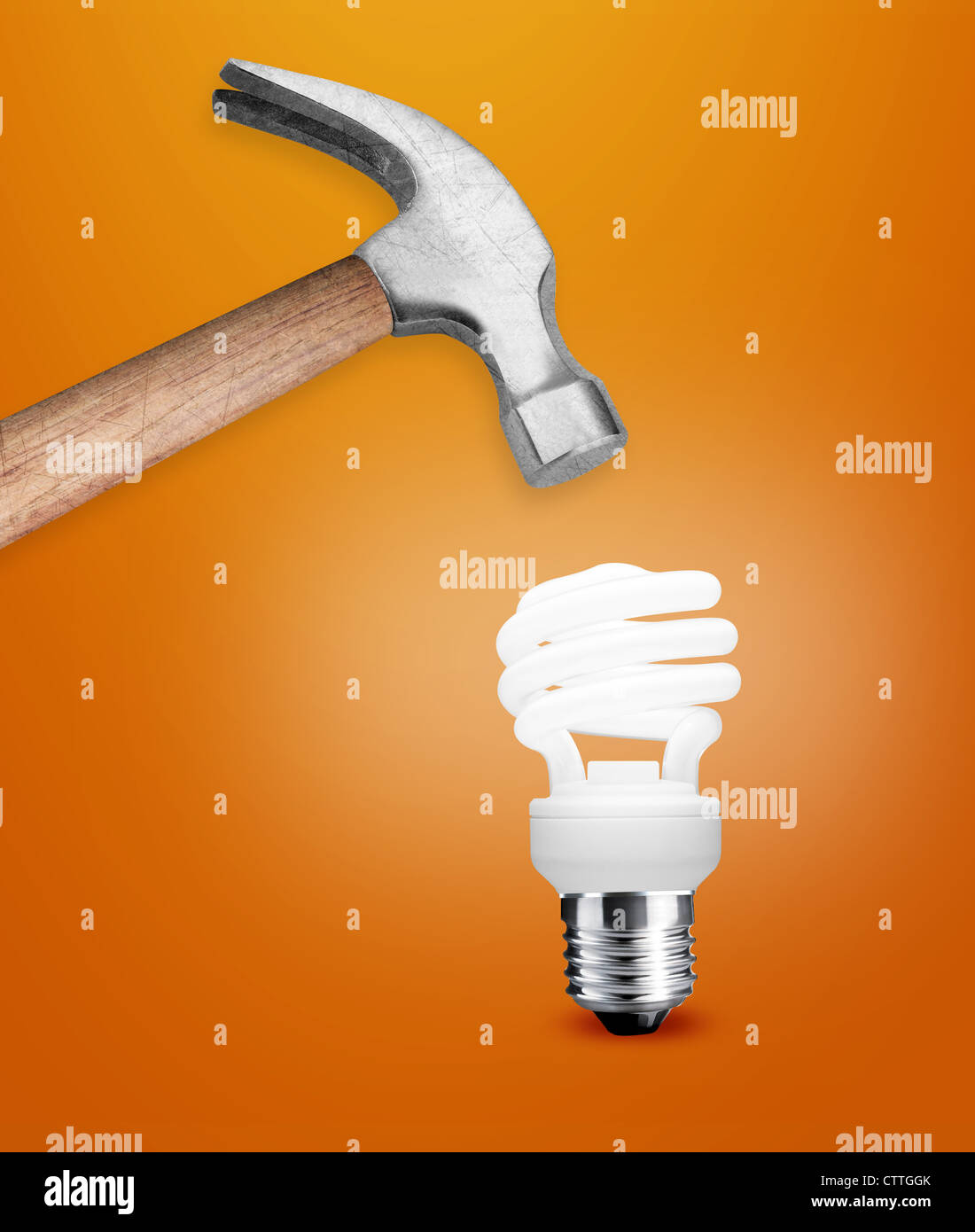 Hammer hitting a lightbulb Stock Photo Alamy