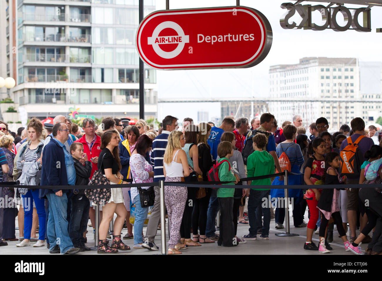 Passengers queue at the Royal Docks Air-Line cable car departures entrance, London, England, UK Stock Photo