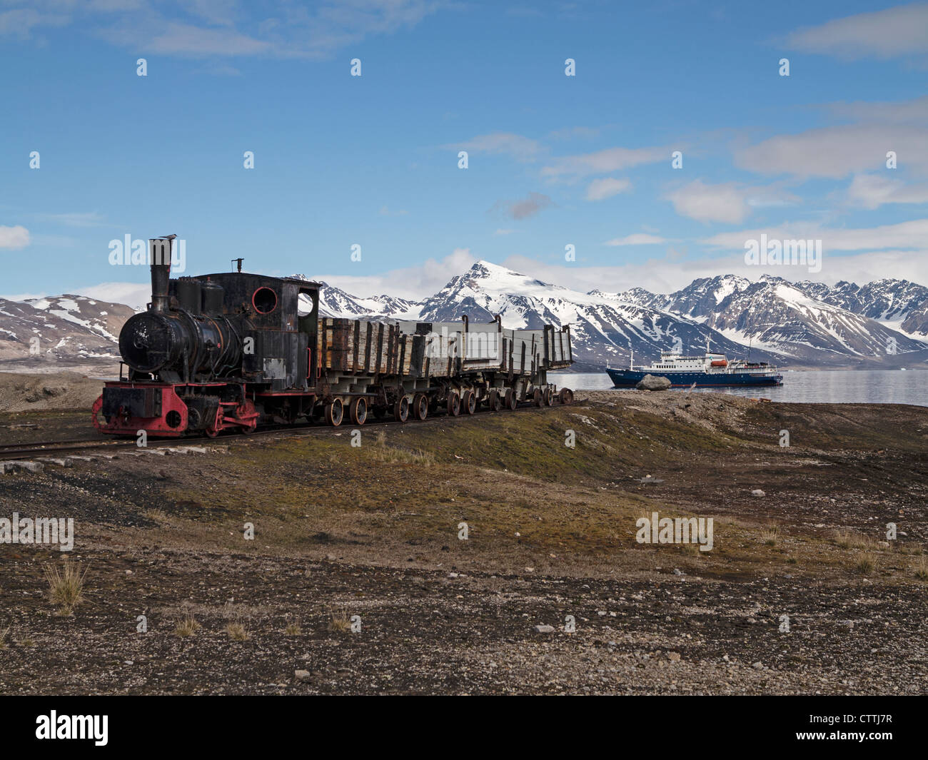 Preserved engine and trucks from early coal mining operations Ny Alesund Spitsbergen Norway Stock Photo