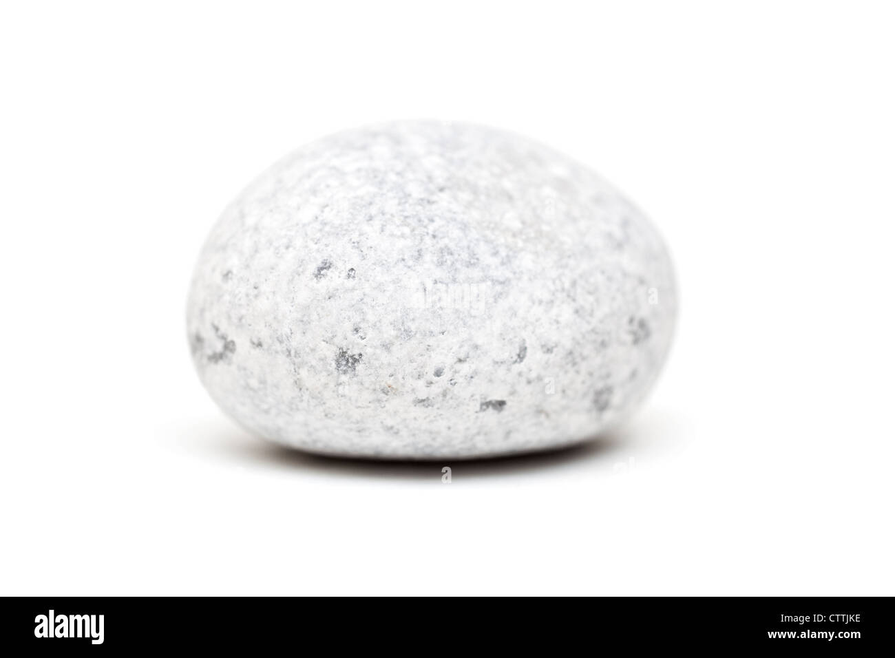 Smooth gray stone isolated on a white background with shadow Stock Photo