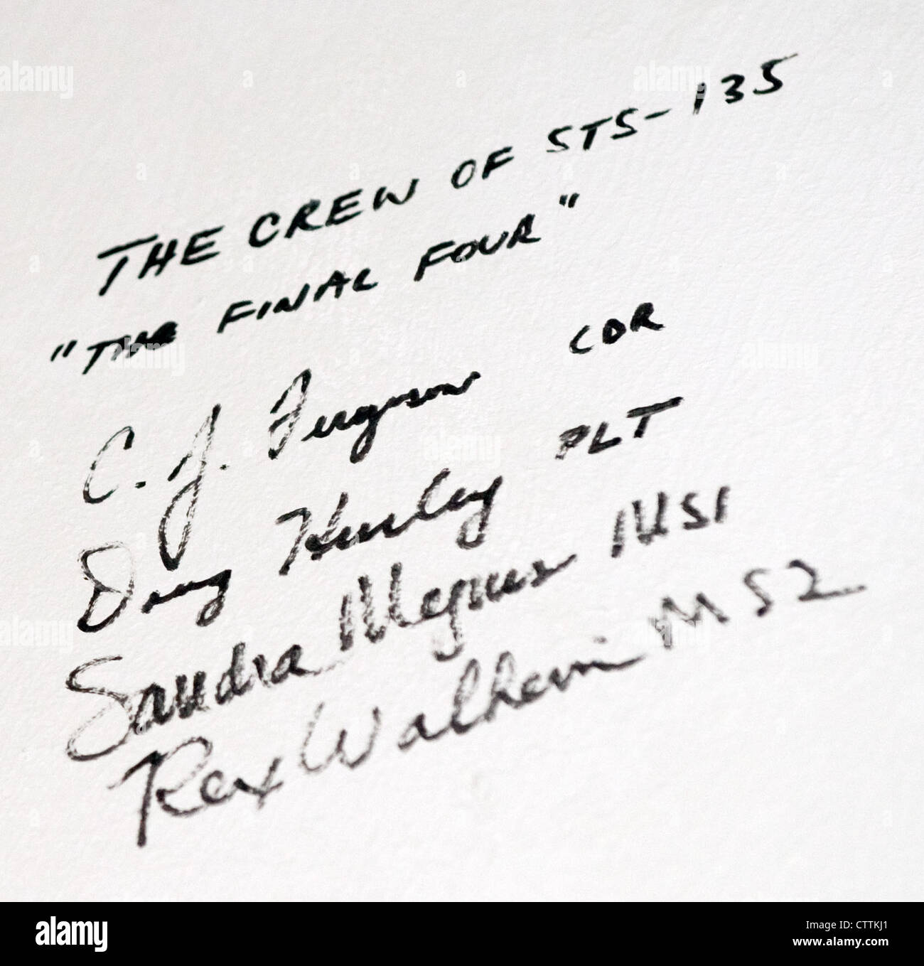 STS-135 crew members sign hardware during training at NASA’s Johnson ...