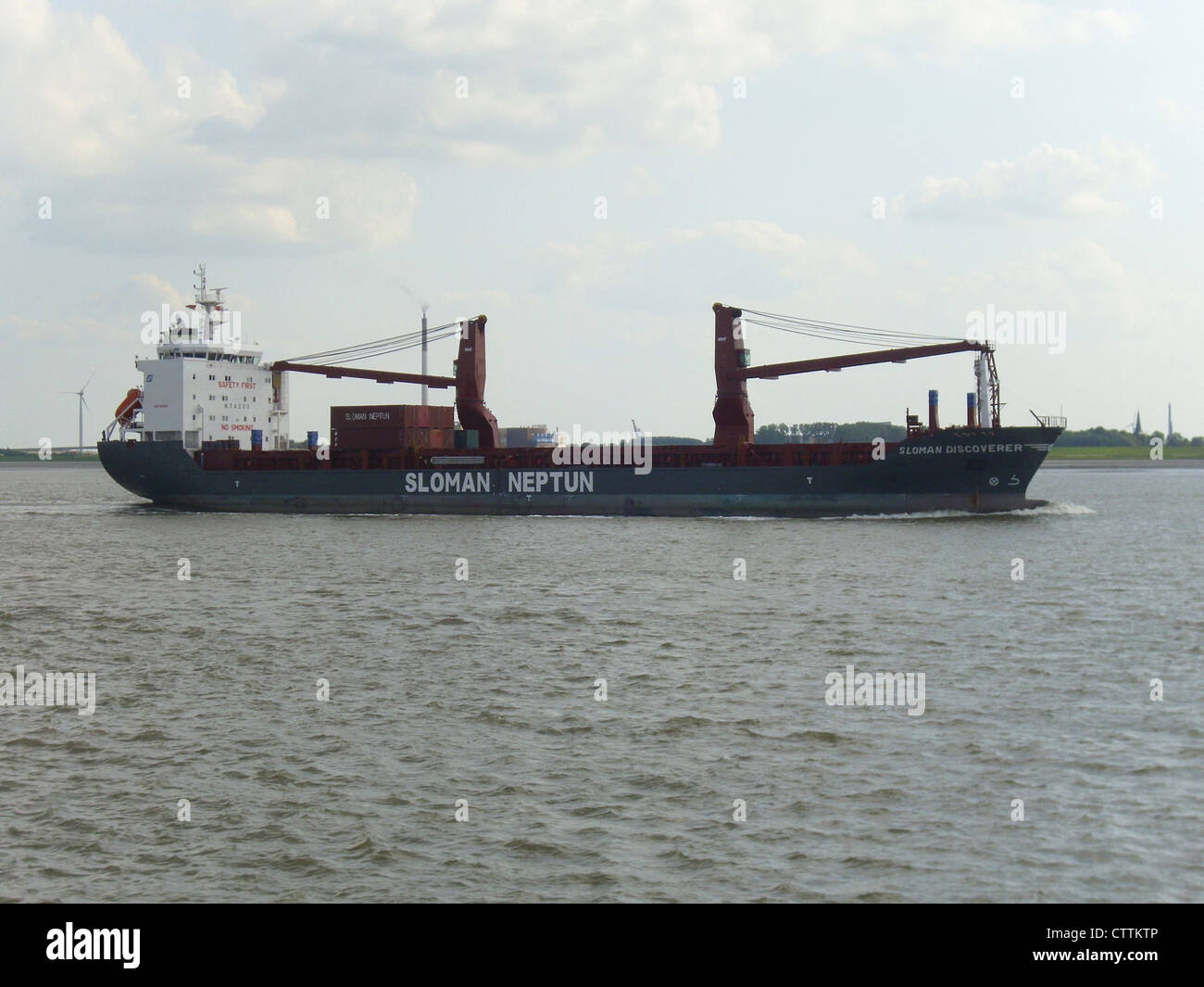 The cargo ship '''Sloman Discoverer''' outbound on the river Weser Stock Photo