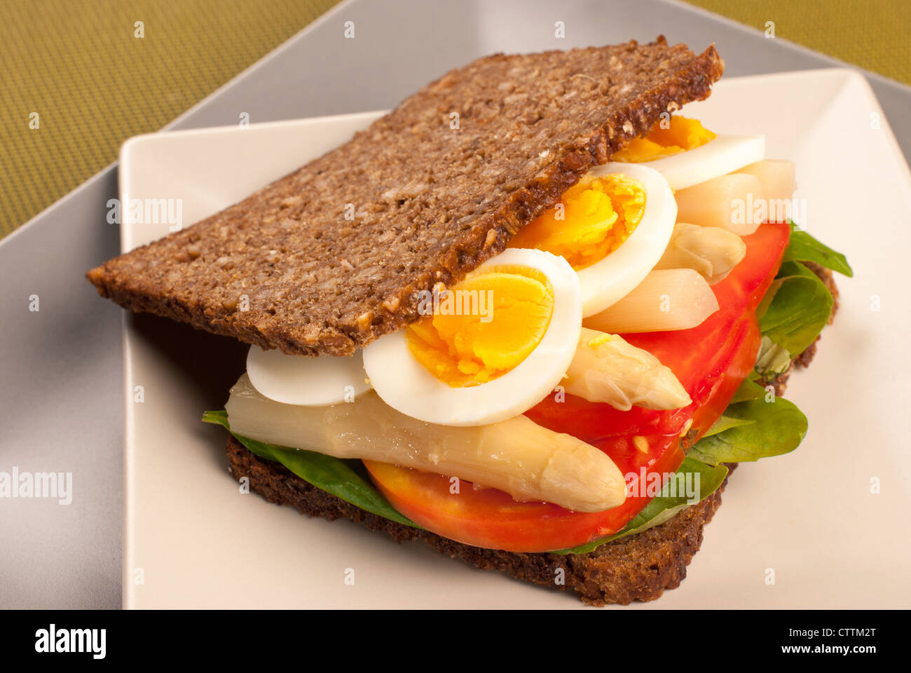 Pumpernickel style rye bread with a healthy vegetarian fillling Stock Photo