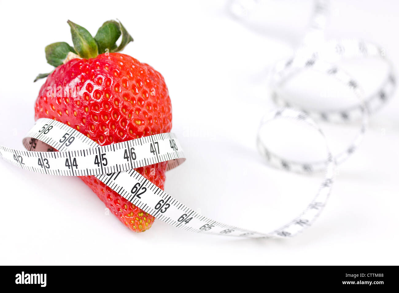 Strawberry with measure tape, closeup on white background Stock Photo ...