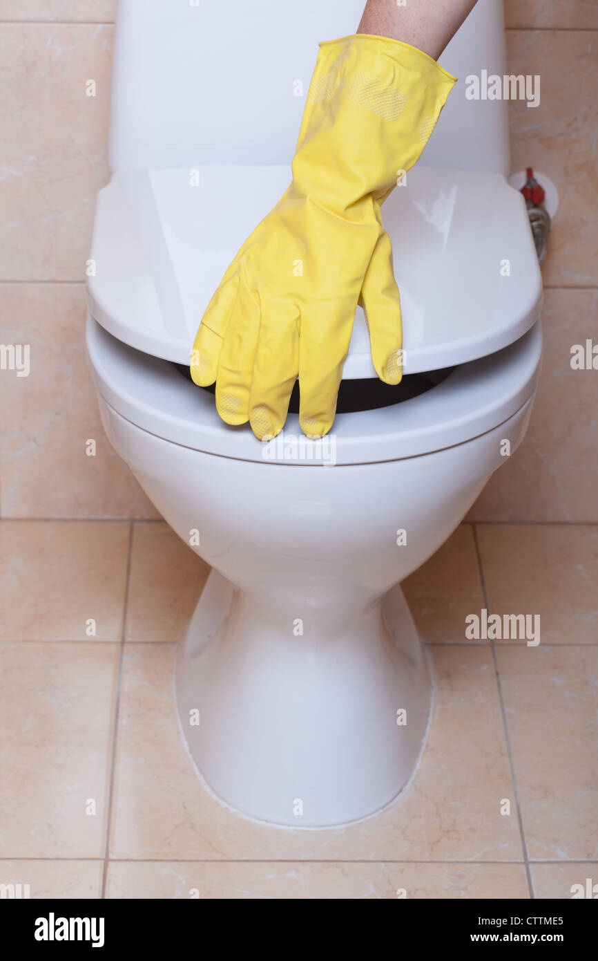 Wc Hand Sign WC hygiene concept, hand in yellow glove making signs Stock Photo - Alamy