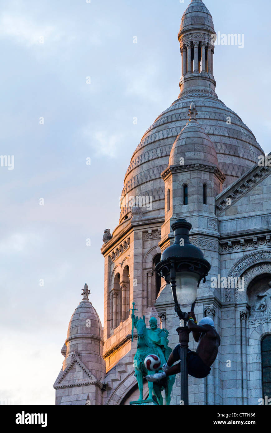 Paris, France, Detail, Street Performer Hanging on Street Lamp in Montmartre Area, Sacre Coeur Basilica Stock Photo