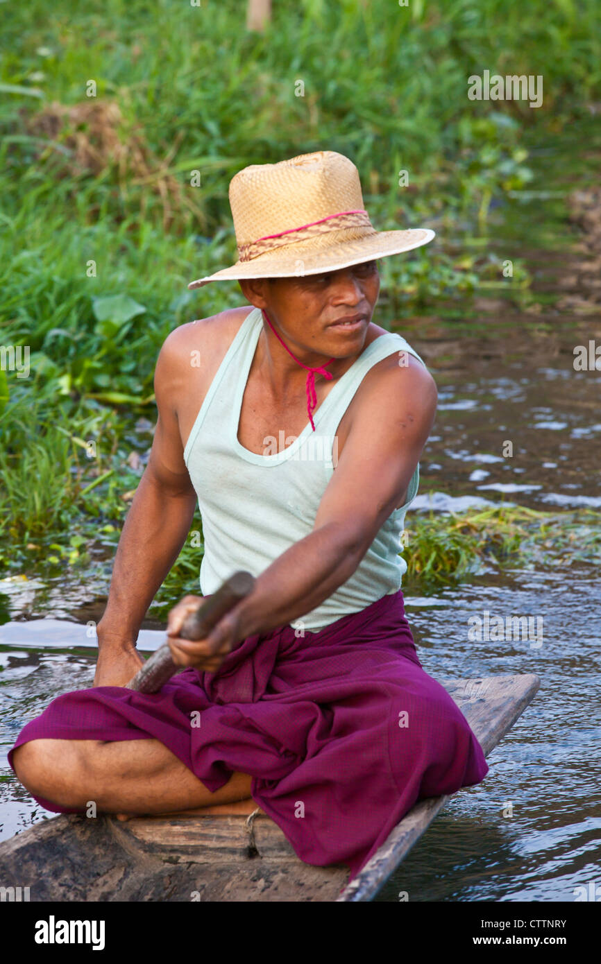 Hand made WOODEN BOATS are the main form of transportation on INLE LAKE - MYANMAR Stock Photo