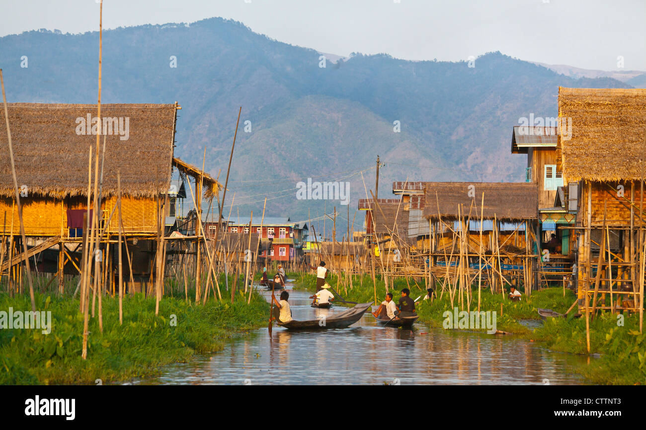 Hand made WOODEN BOATS are the main form of transportation the village of PWE SAR KONE - INLE LAKE, MYANMAR Stock Photo