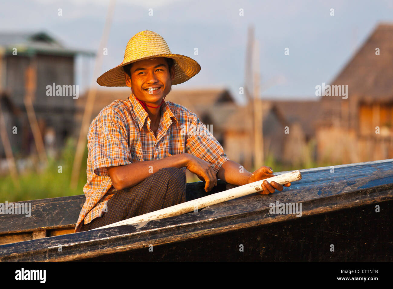 Hand made WOODEN BOATS are the main form of transportation on INLE LAKE - MYANMAR Stock Photo
