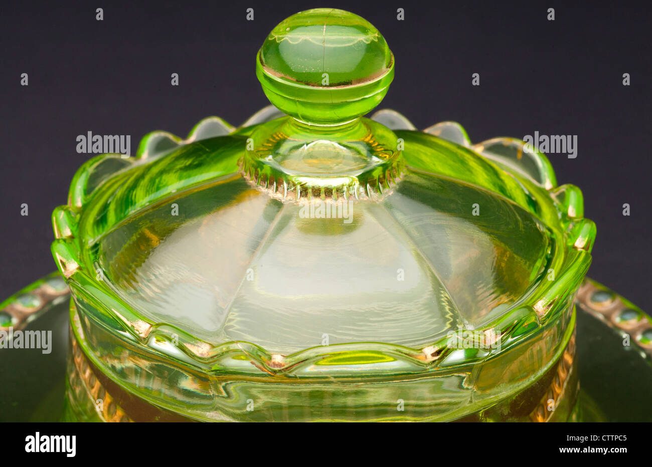 Top view of a Ranson 'gold band' Vaseline 'uranium glass' round covered butter dish produced by the Riverside Glass Co. in 1899. Stock Photo