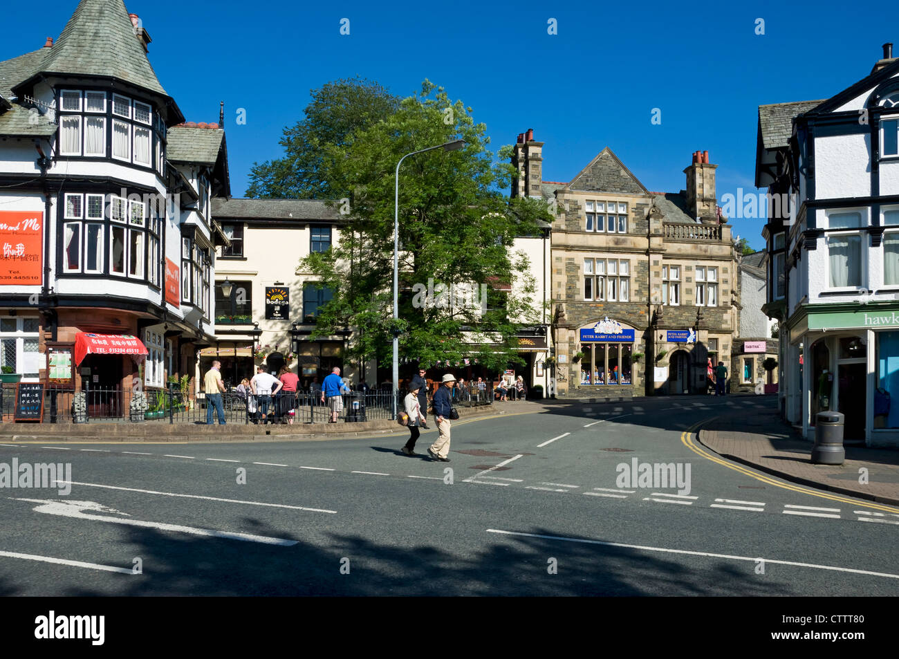 People visitors tourists visiting walking in the town centre in summer Bowness on Windermere Cumbria England UK United Kingdom GB Great Britain Stock Photo