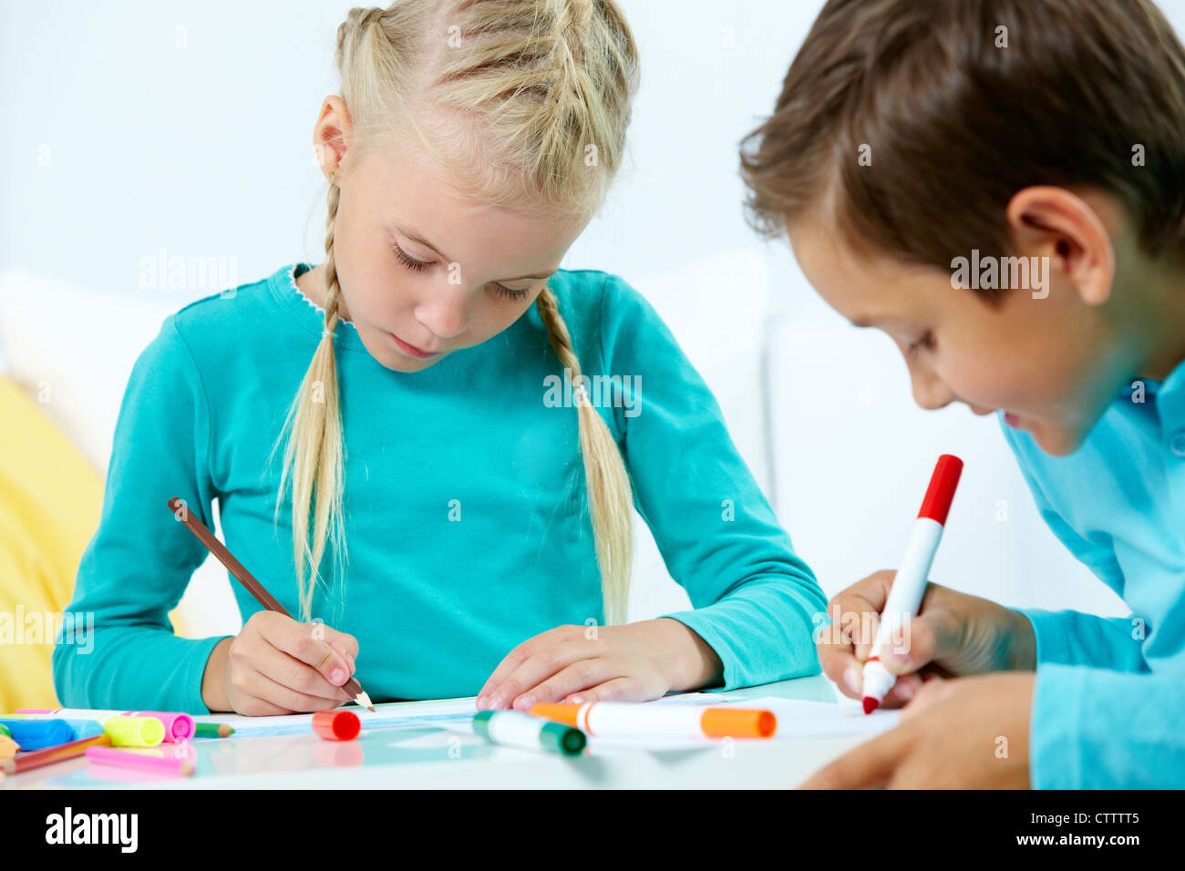 Portrait of lovely girl and boy drawing with colorful pencils Stock ...