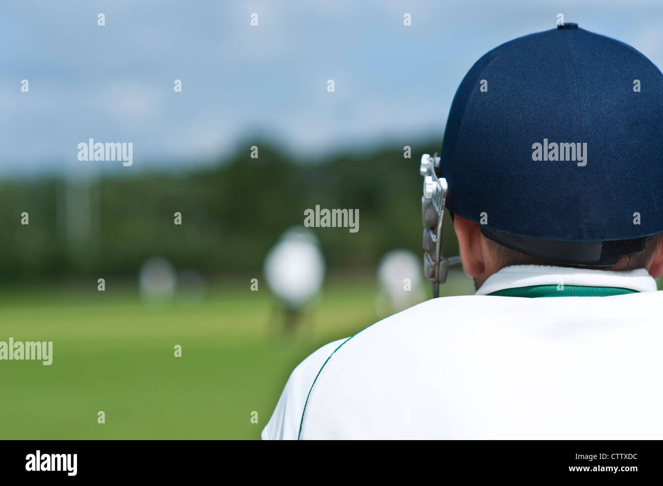 Cricketer watches cricket match Stock Photo Alamy