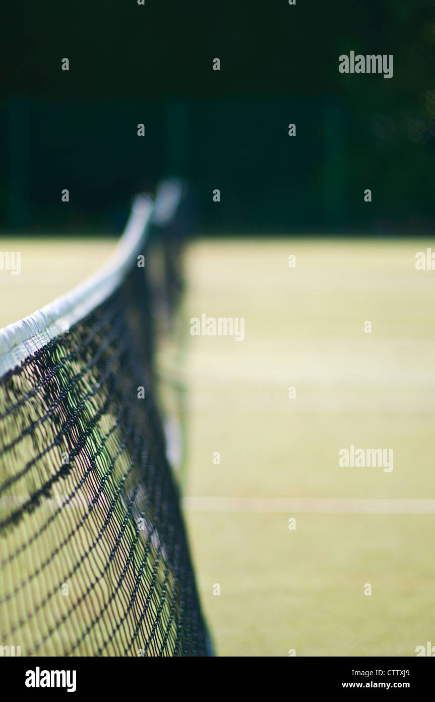 Tennis court net blowing in breeze. Stock Photo