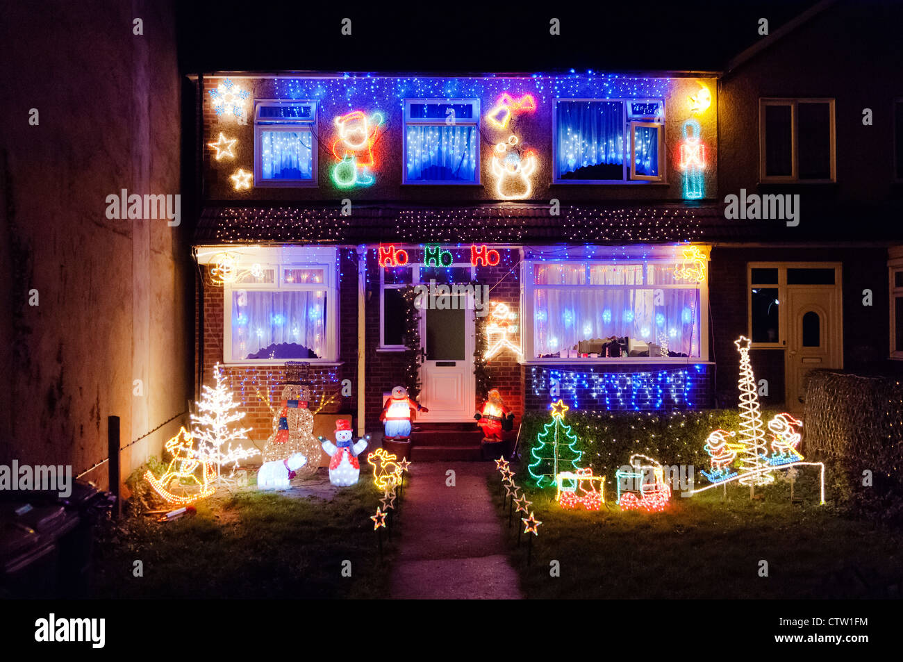 Over the top and tacky Christmas decorations on a residential house in West Thurrock, Essex. Stock Photo