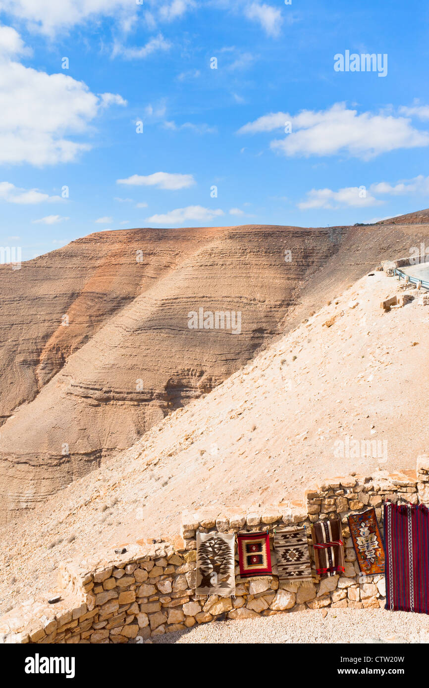 traditional bedouin carpets on stone wall in Jordan mountain Stock