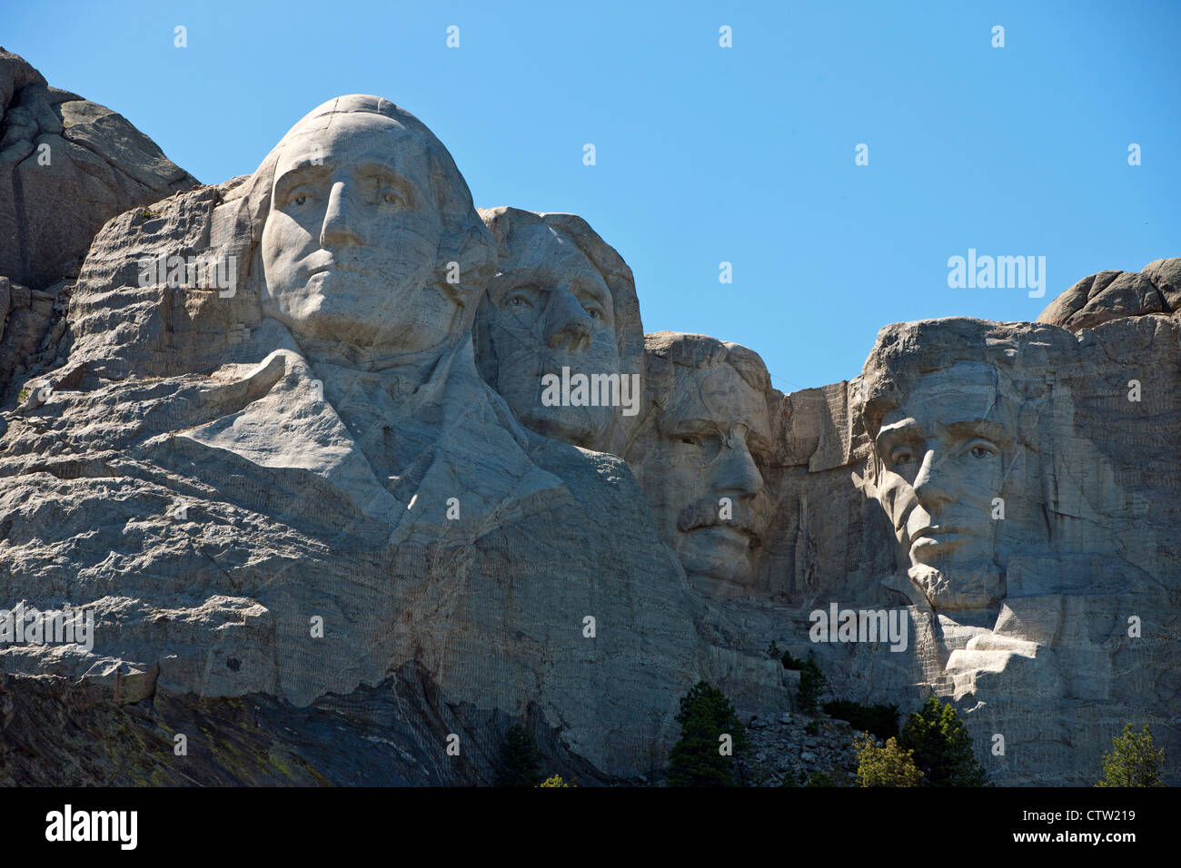 Detailed view Mt. Rushmore with sculptures of former presidents George Washington, Thomas Jefferson, Theodore Roosevelt, and Abraham Lincoln, Mount Rushmore National Monument, South Dakota, United States of America Stock Photo