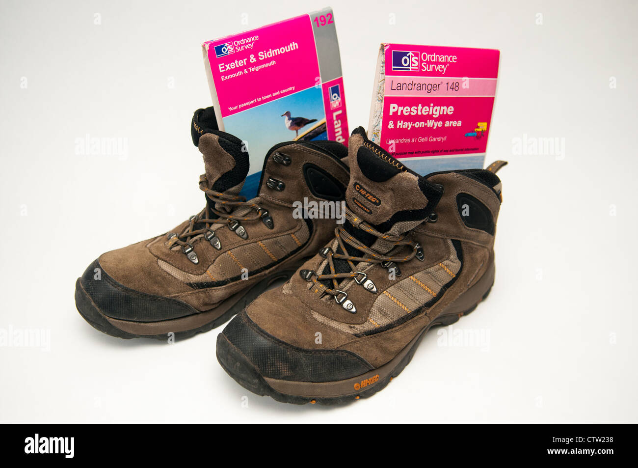 Walking boots with Presteigne and Exeter and Sidmouth OS maps Stock Photo