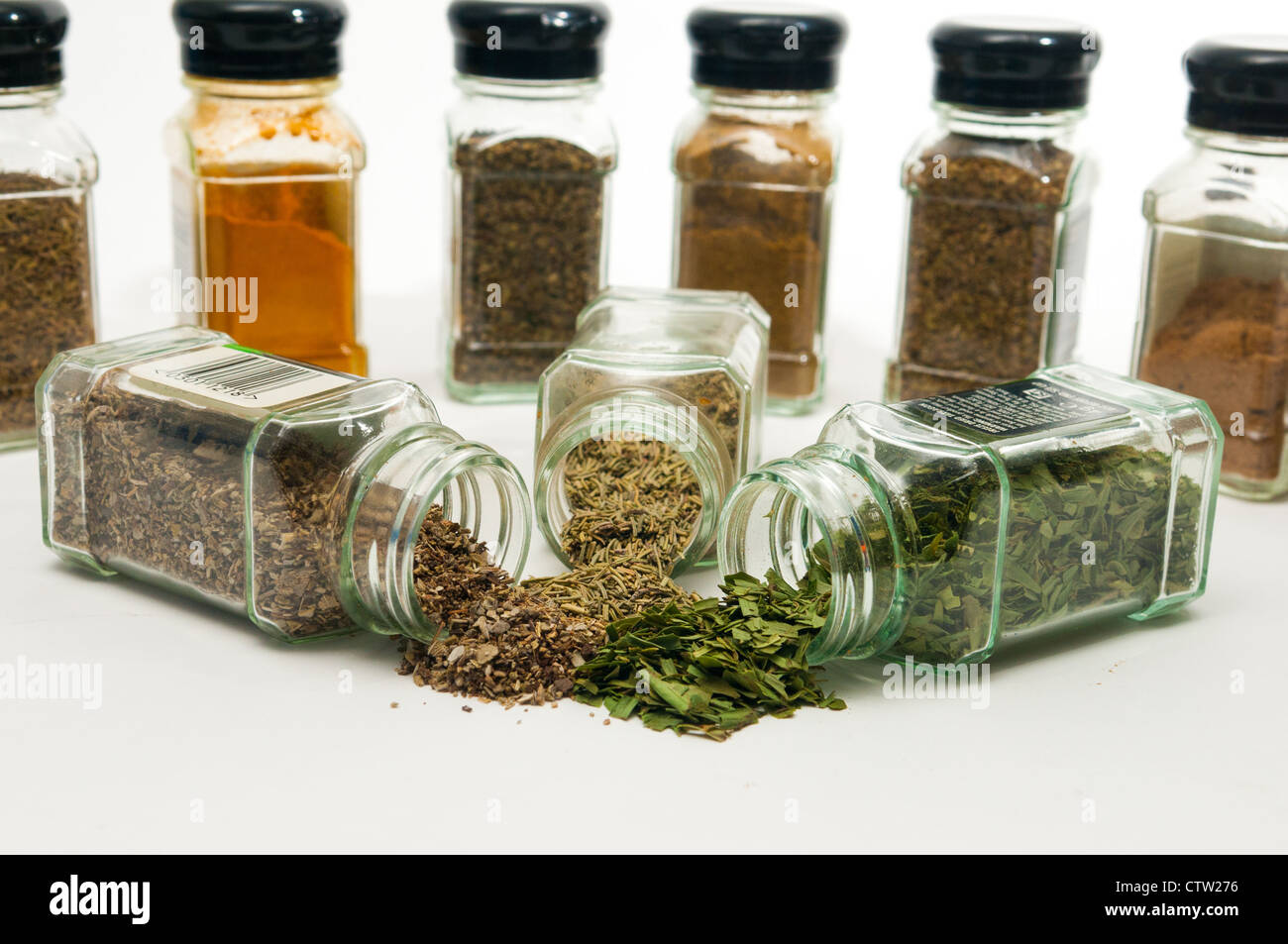 Pile of herbs with jars of herbs in the background Stock Photo Alamy