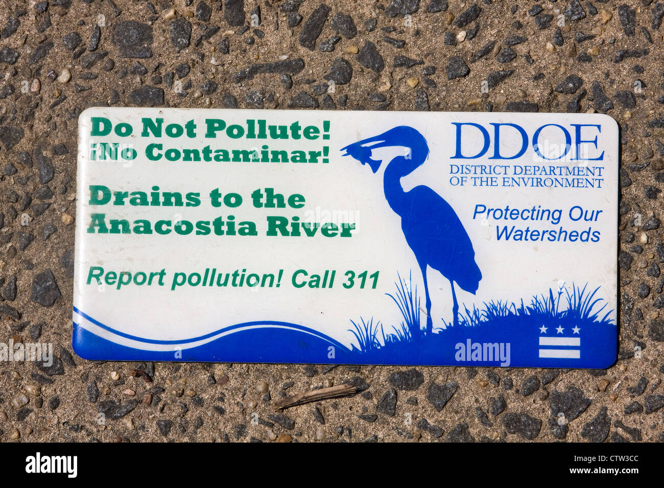 District of Columbia Department of the Environment Do Not Pollute Drains to Anacostia River sign on top of a storm drainage Stock Photo