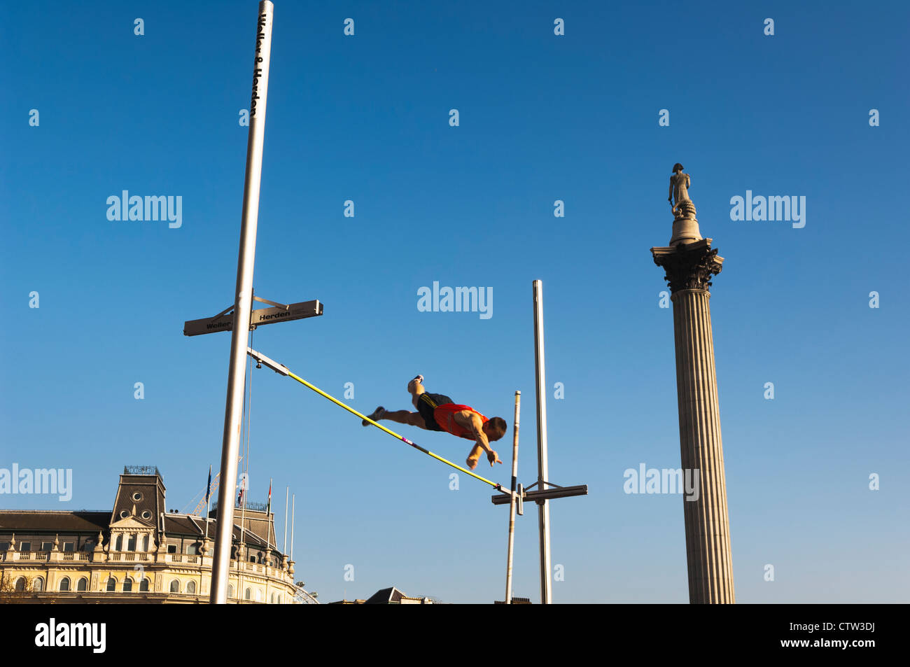 Pole vault in Trafalgar Square, as part of a celebration of Dutch culture, during the Holland House Festival 2010. Stock Photo