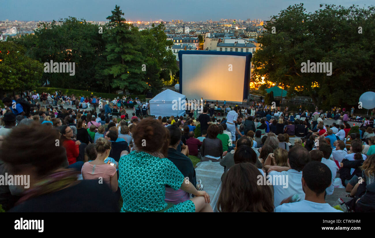 Paris, France, Open Air, Crowd Audience at Outdoor French CInema Show, 'Forum des Images', in the Butte Montmartre Park, with screen, free event france, people at the movies Stock Photo