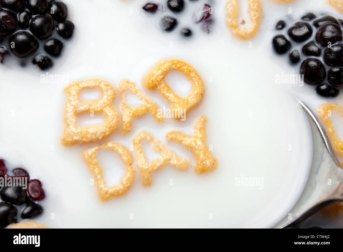 A bowl of alphabet cereal pieces floating in milk with the words BAD
