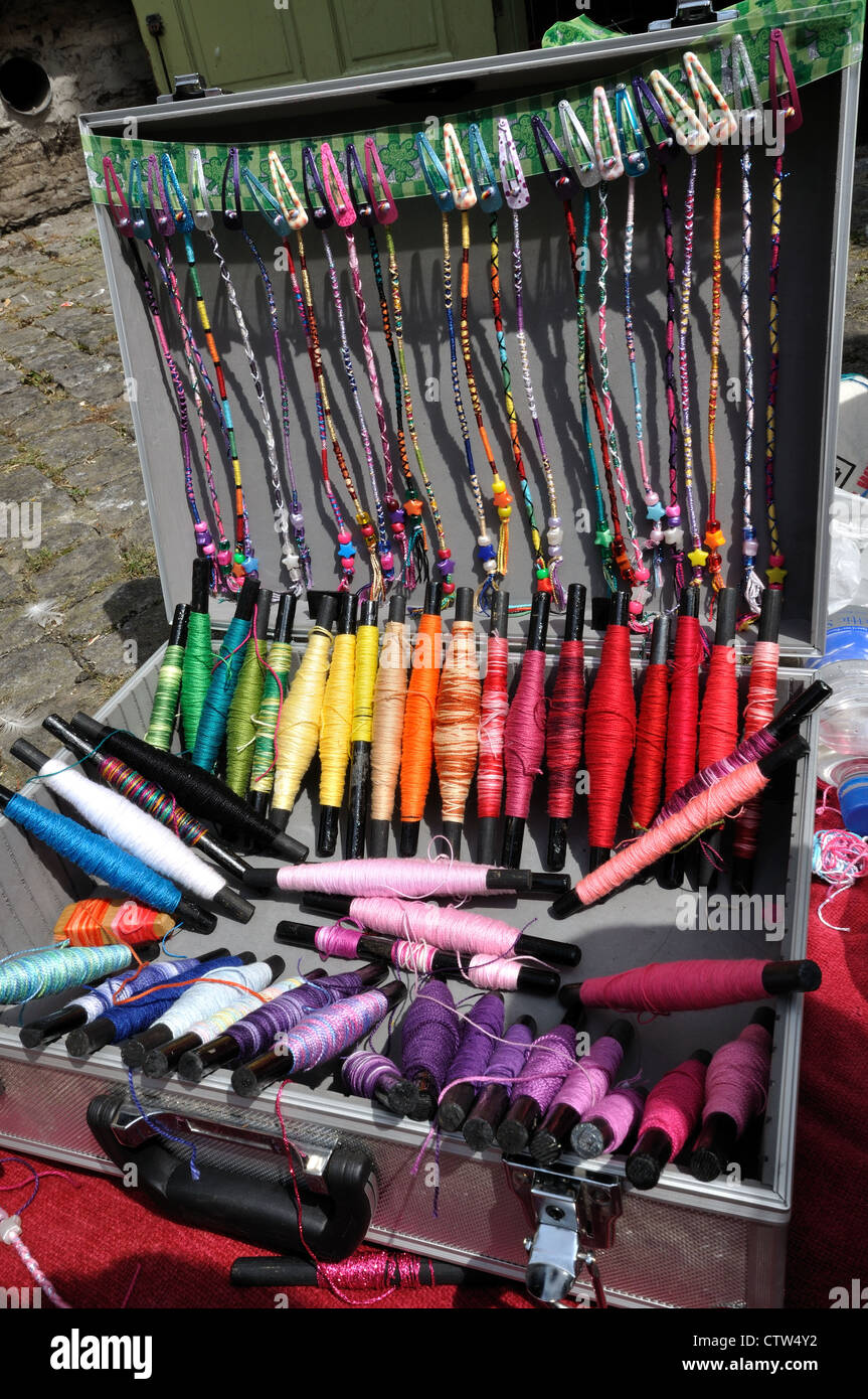 Hair braiding equipment and the finished articles Stock Photo Alamy