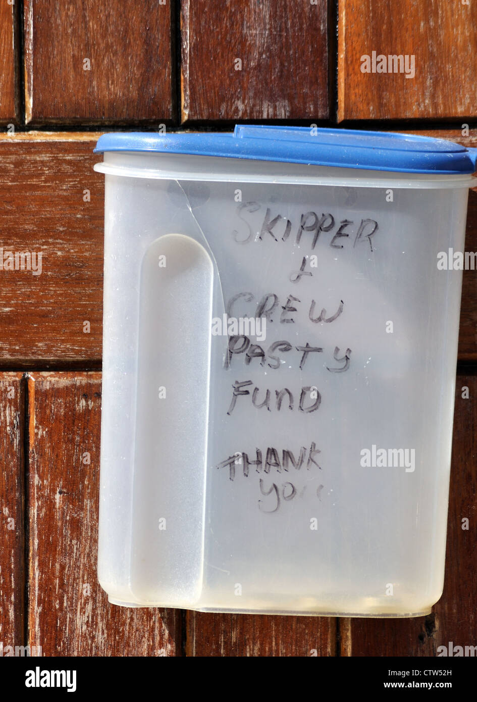 Novel method for collecting tips on board the St Mawes to Falmouth ferry.  Reads "skipper and crew pasty fund, thank you" Stock Photo