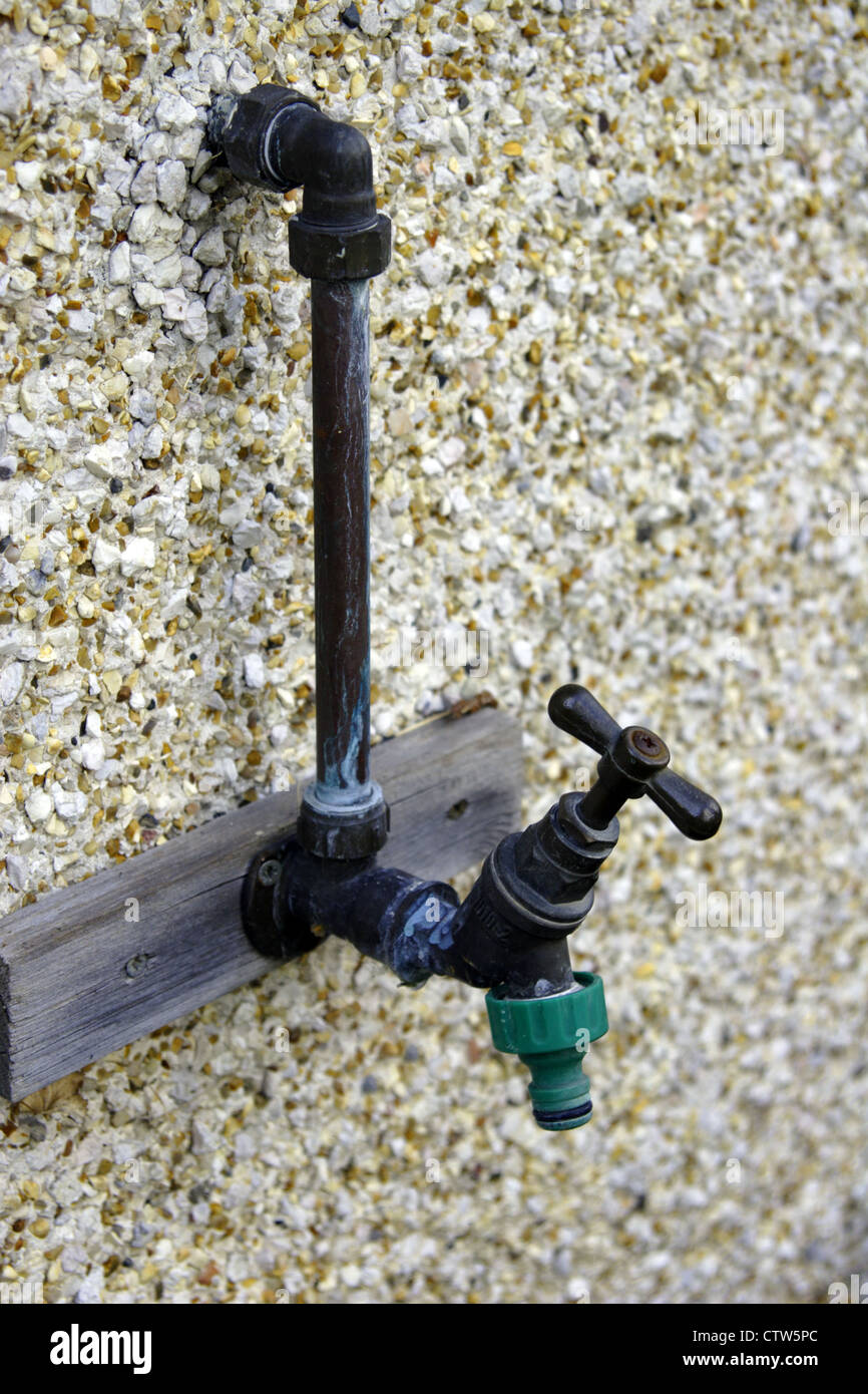 Wall mounted outdoor tap Stock Photo