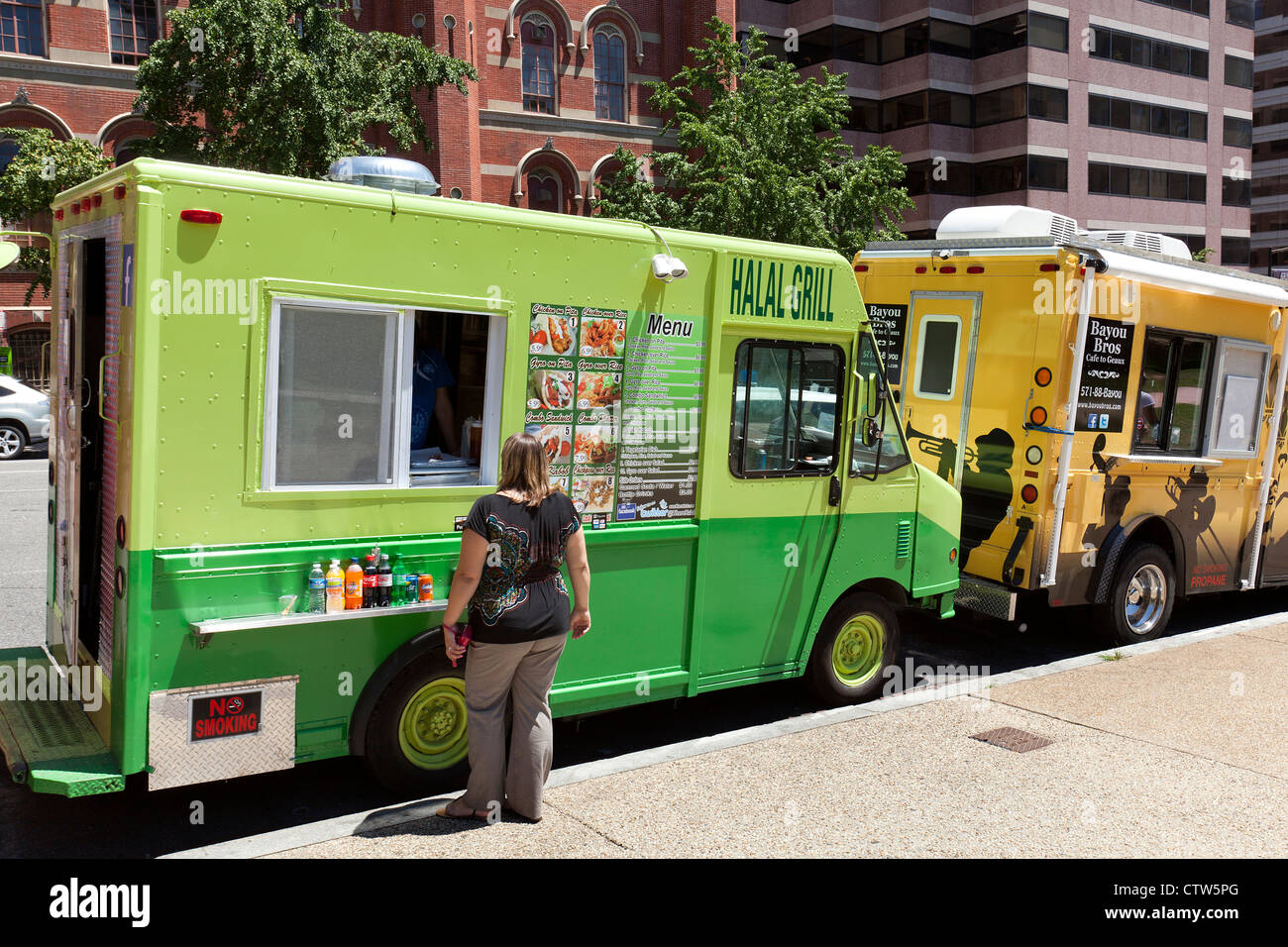 Food trucks line up on an urban street  - Washington, DC USA Stock Photo
