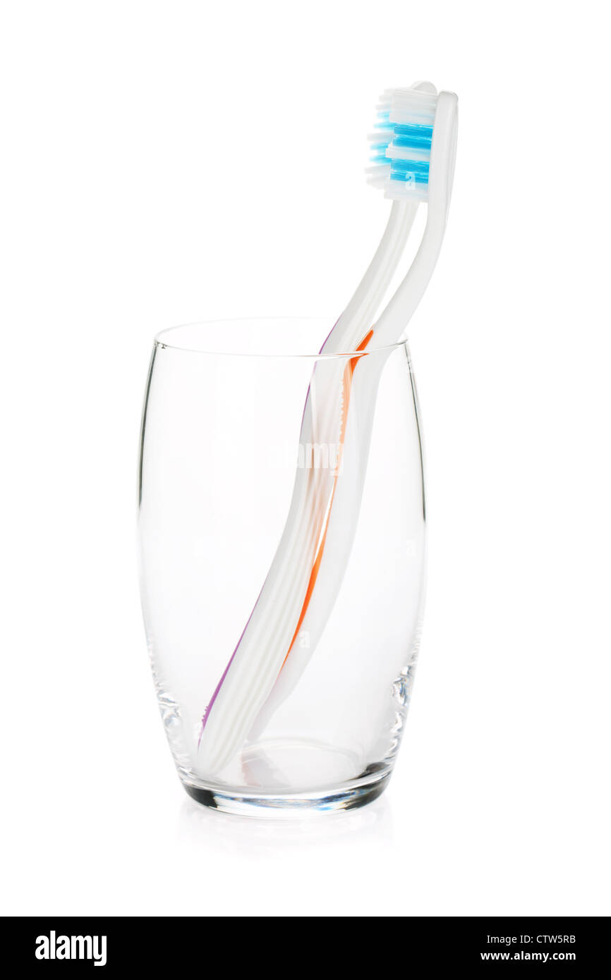 Two toothbrushes in a glass. Isolated on white background Stock Photo ...